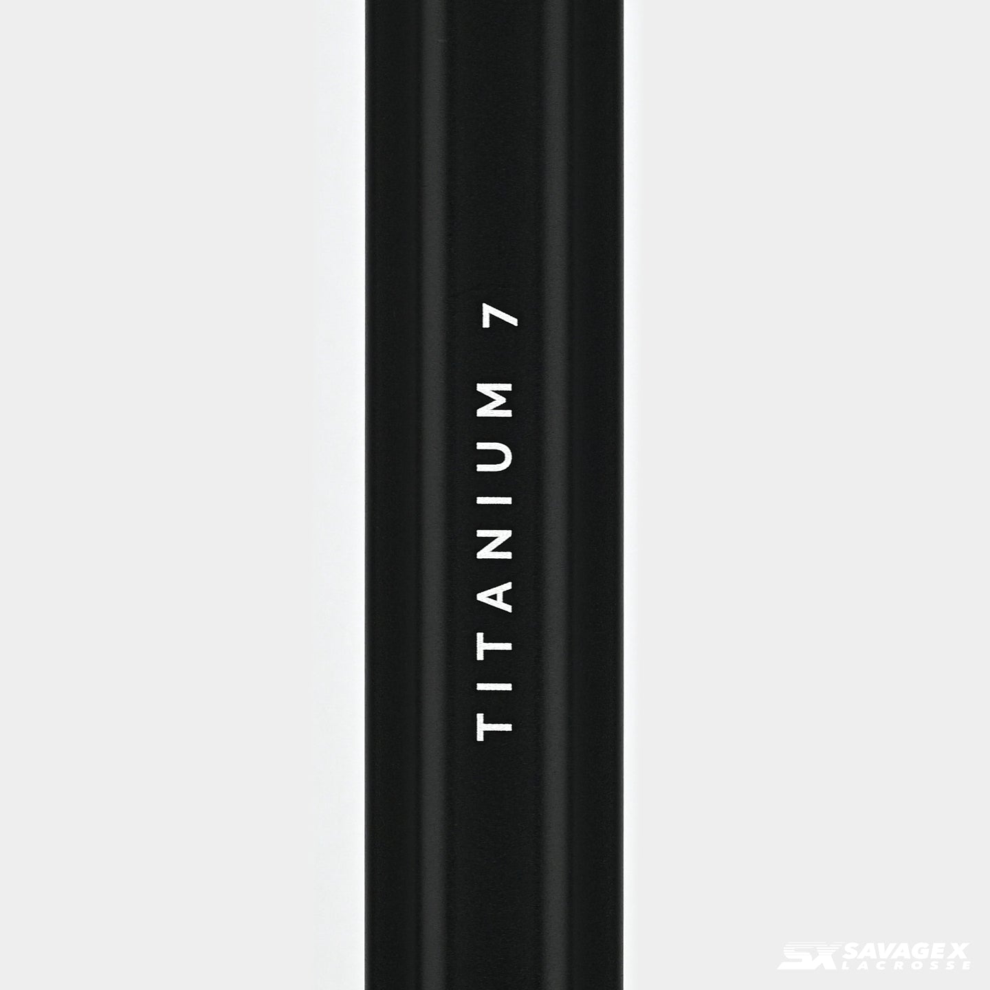 A product video of the Savage X Lacrosse Titanium 7 shaft, in Black colorway, showing a closeup view of the logo graphic and a 45 degree view of the shaft.