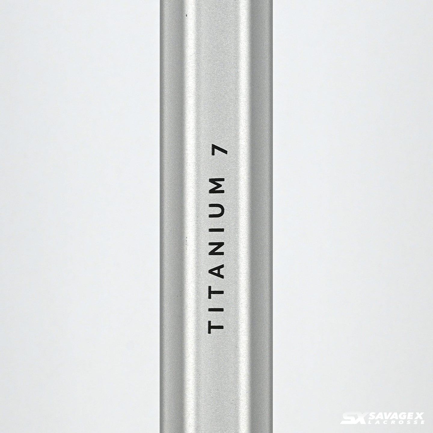 A product video of the Savage X Lacrosse Titanium 7 shaft, in Silver colorway, showing a closeup view of the logo graphic and a 45 degree view of the shaft.